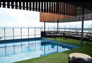 a swimming pool with a view of the ocean at Hotel Sun in Encarnación