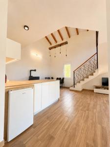 an open kitchen and living room with a staircase at Villa Marija in Livno