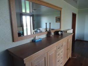 a bathroom with a vanity with a large mirror at Brouckmolen in Alveringem +33 photos