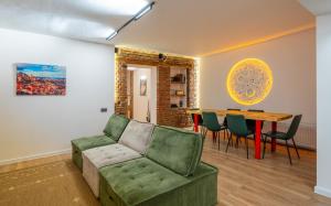 a living room with a couch and a table at Niabi 3BDR Villa with pool in Tbilisi City