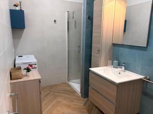 a bathroom with a sink and a shower at Circe Casa Vacanze in San Menaio +31 photos