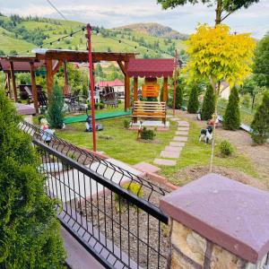 a view of a park with a playground at Casa Izvorul Muntelui in Sadova