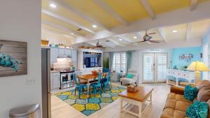 a kitchen and living room with a couch and a table at Lighthouse Unit B in Jekyll Island