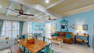 a living room with a table and a couch at Lighthouse Unit B in Jekyll Island