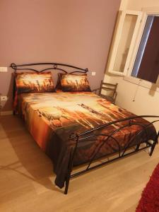a large bed in a bedroom with a window at Ranch Borgo Bellavita in Fossalta Maggiore