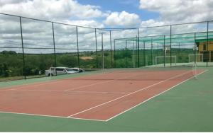 a tennis court with a net on top of it at Flat 705 Winterville - Gravatá in Gravatá