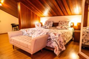 a bedroom with a bed with a bunny on it at Pousada Vollweiter in Entre Rios