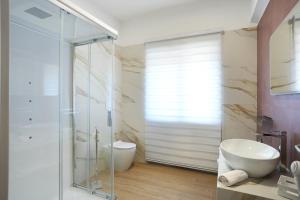 a bathroom with a glass shower and a toilet at La Terrazza del benessere in Ferrazzano +36 photos
