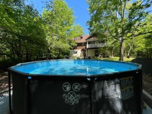 a hot tub in front of a house at Luxury Mountain Villa - 3 bedroom, hot-tub, fire-pit in Hunter