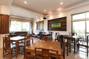 Zona de estar de Chun Feng Cao Tang Homestay