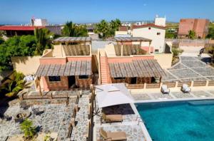 an aerial view of a resort with a swimming pool at Casa San Jerónimo Departamentos in Todos Santos
