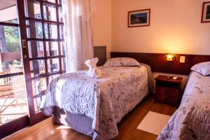 a room with two beds and a window at Pousada Vollweiter in Entre Rios +104 photos