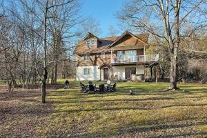 a large house with a deck on a yard at Luxury Mountain Villa - 3 bedroom, hot-tub, fire-pit in Hunter