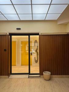 a room with a glass door with a sign on it at Pensión Ariz in Basauri +6 photos