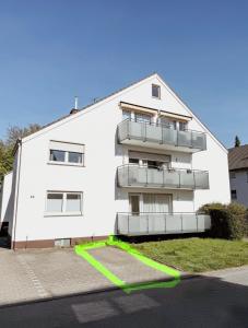 a white building with balconies on the side of it at FeWo Reimer in Horn-Bad Meinberg