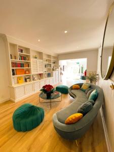 a living room with a large couch with pillows at Antonio's House in Sitges
