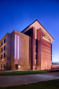 a building with a sign on the side of it at Golden Mesa Hotel in Guymon
