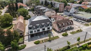 an aerial view of a town with a building and a street at ELYX Home Apartmanok in Sárvár
