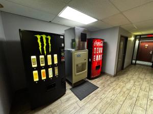 a room with two vending machines and a cocacola machine at Super 8 by Wyndham Conway in Conway
