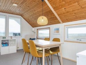 a dining room with a table and chairs at 4 person holiday home in Lemvig in Lemvig