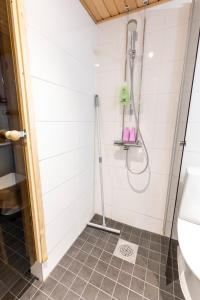 a bathroom with a shower and a toilet at Voimakelo - renovated - near ski bus in Kuusamo +19 photos