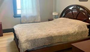 a bedroom with a bed and a window at Blue House in Halifax +2 photos
