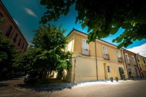 a building with a tree in front of it at B&B Hipponion in Vibo Valentia