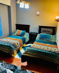 a room with two beds in a room at Porto sokhna pyramids in Ain Sokhna