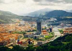 a view of a city with mountains in the background at Pensión Ariz in Basauri
