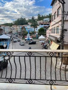 a balcony with a view of a parking lot at Pousada Solar Central in Prados