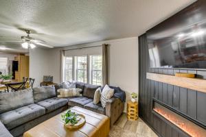 a living room with a couch and a fireplace at Fire Pit & Stunning Lake Views: Shell Knob Home! in Shell Knob