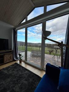 a living room with a large sliding glass door at Weitblick- Sauna- WLAN- Haus 3 in Neheim-Hüsten