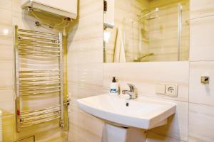 a bathroom with a sink and a shower at Domki u danusi in Stężyca +38 photos