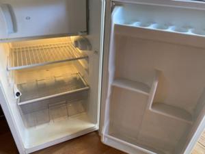 an empty refrigerator with its door open and its door at Tiny house tout inclus in Fronton +18 photos