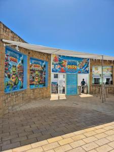 a building with banners on the side of it at Marina smir Oceanica Apartments in Marina Smir