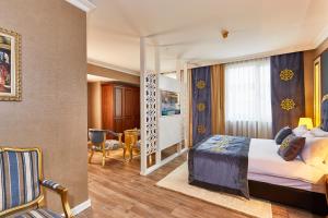 a hotel room with a bed and a dining room at Seres Hotel Old City in Istanbul +58 photos