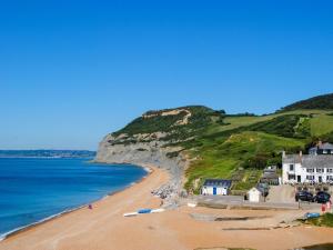 a view of a beach with houses and the ocean at 4 Bed in Seaton oc-s27403 in Seaton
