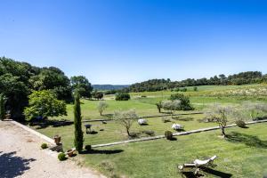 a view of a park with sheep in a field at Maison Roque in Sannes