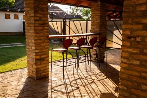 a group of chairs sitting on a patio at Rodjino imanje in Palić +18 photos