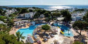 an aerial view of a pool at a resort at hotel apartamento es Talaial in Cala d´Or