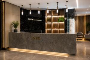a lobby of an indore hotel with a reception desk at Golden River Hotel By Continent in Arnavutköy