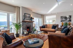 a living room filled with furniture and a fireplace at The Iveragh in Kenmare