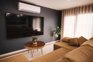 a living room with a couch and a table at Royal Galla Apartment in Macedo de Cavaleiros +25 photos