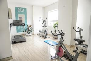 a gym with several exercise bikes in a room at Hotel Sixtina Plaza Medellin in Medellín +69 photos