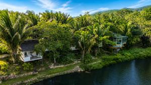 an aerial view of a resort with palm trees at Lagoon Village B&B y SPA in Tarapoto