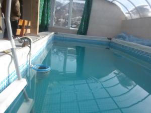a swimming pool in a house with the water in it at Synevyrskyj Chardash in Synevyr