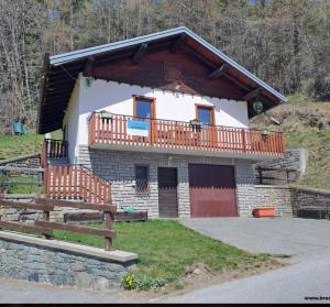 a small building with a balcony on top of it at Villetta Col Ranzola in Brusson