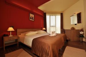 Postel nebo postele na pokoji v ubytování Hotel Fontana