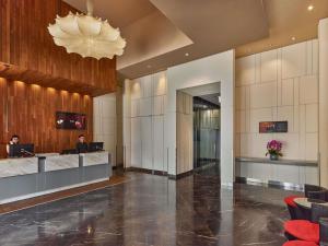 a lobby of a hotel with a reception desk at Ibis Singapore Novena in Singapore