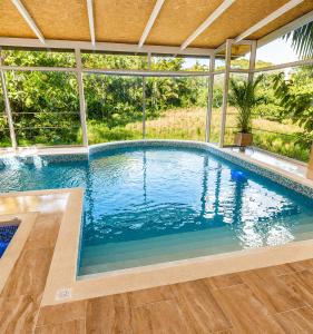 a swimming pool in a house at Lagoon Village B&B y SPA in Tarapoto